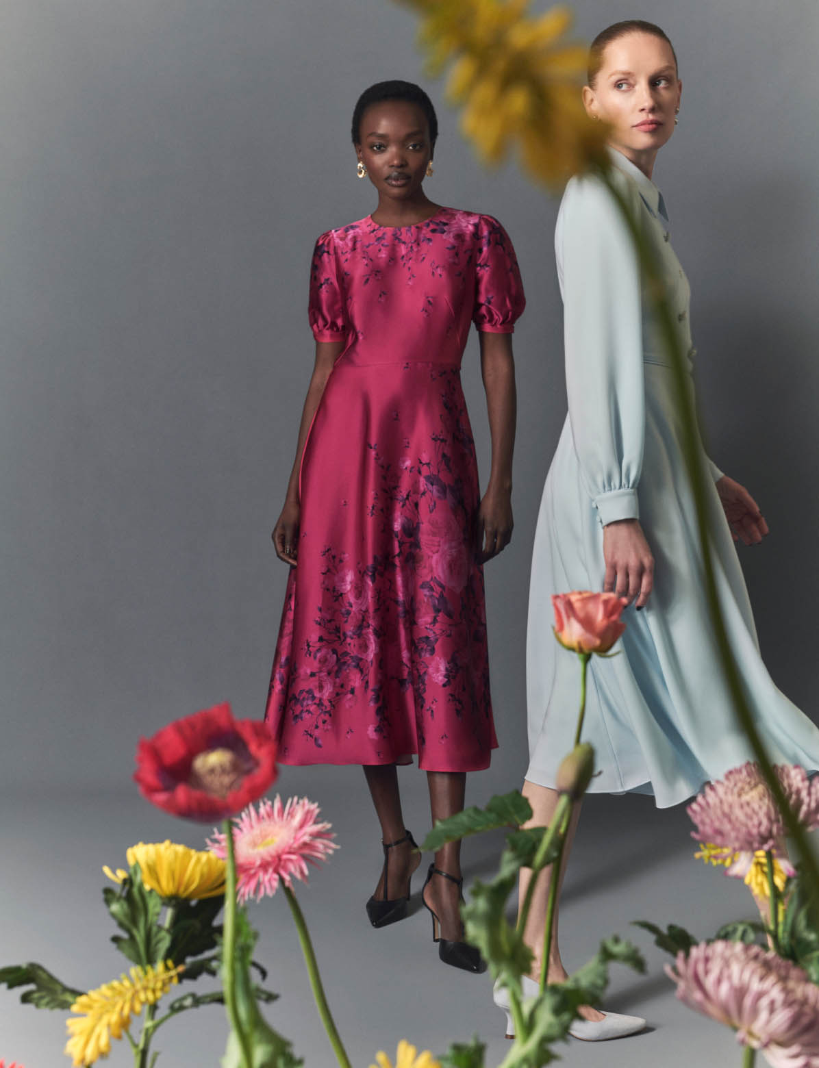 MODELS WEARING HOBBS PINK FLORAL PRING & PALE BLUE DRESSES