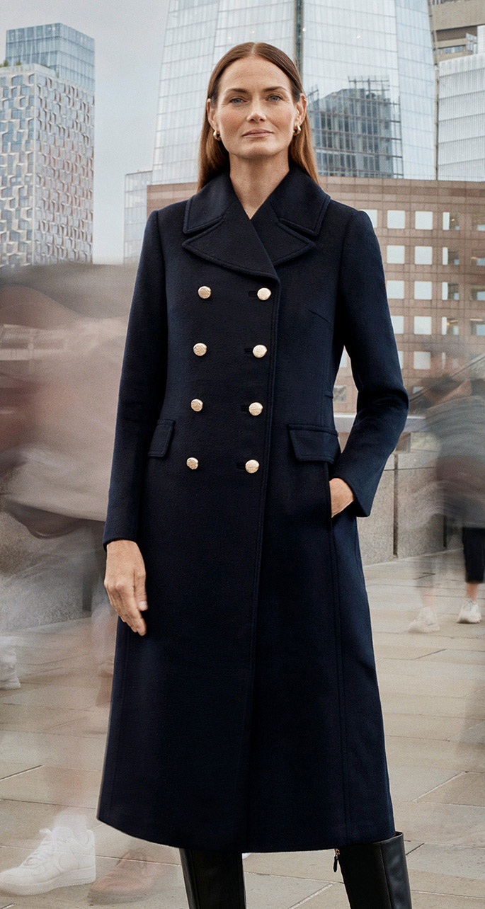 A woman wearing a Hobbs wool coat.
