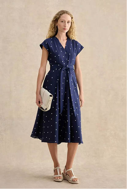 A woman wearing a Hobbs dress.