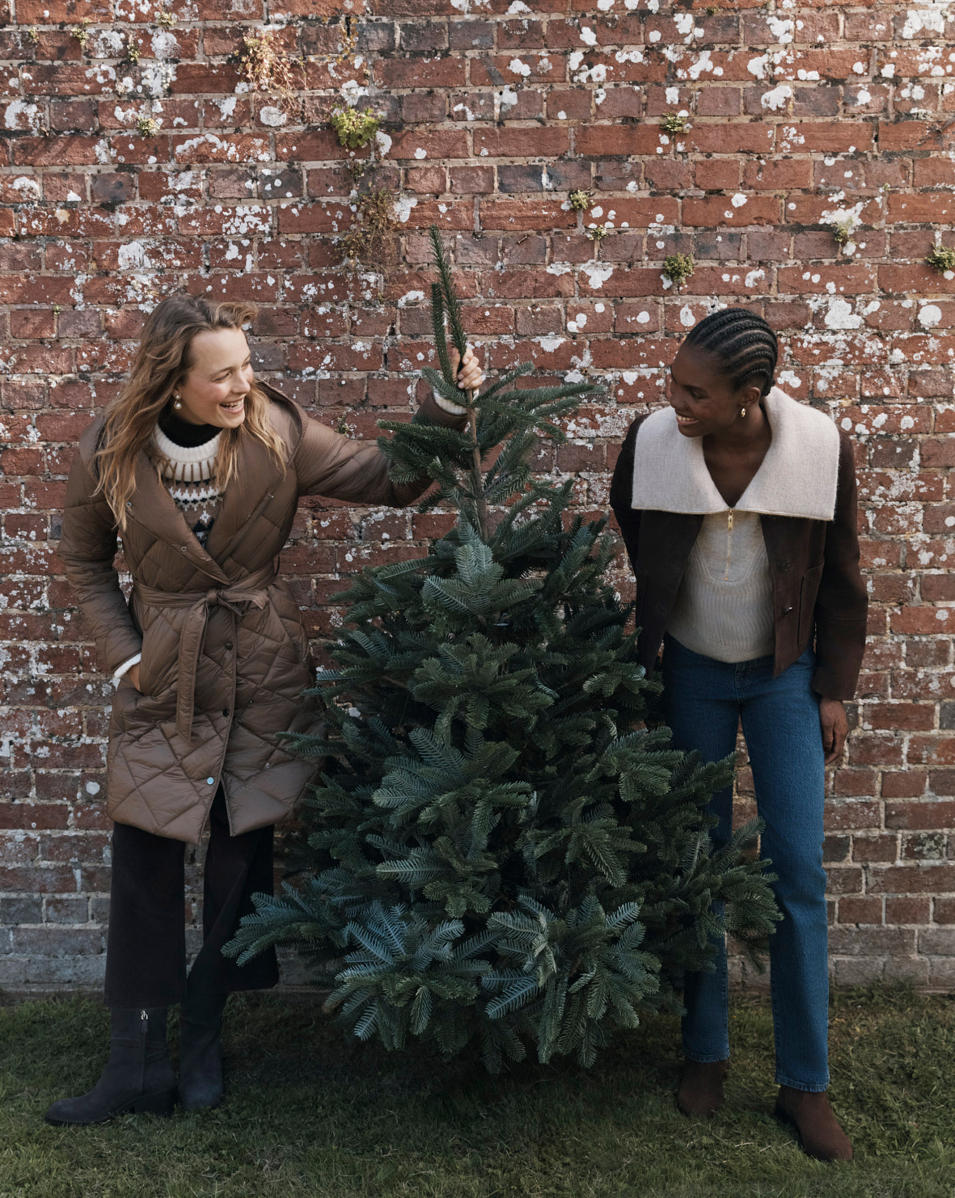 Women wearing a puffer coat and brown suede jacket.