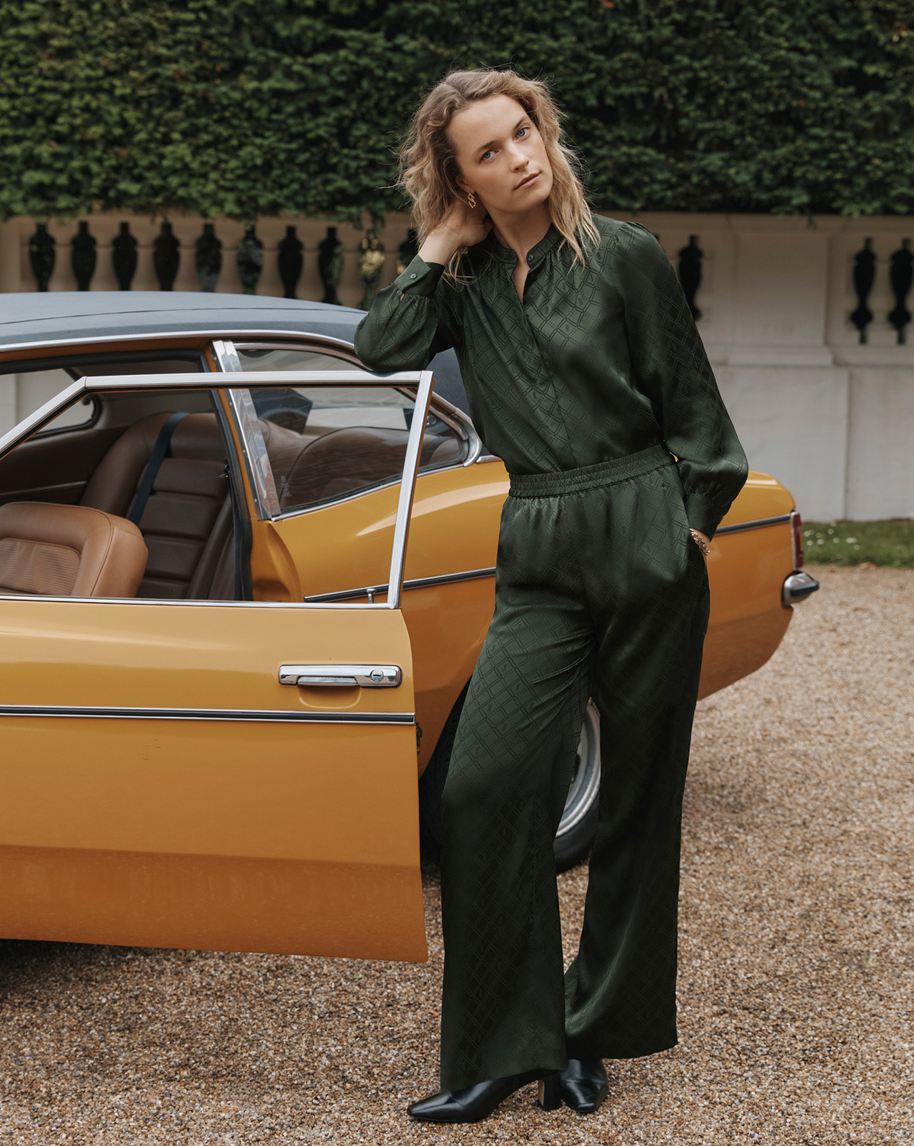 A woman wearing a Hobbs green co-ord.