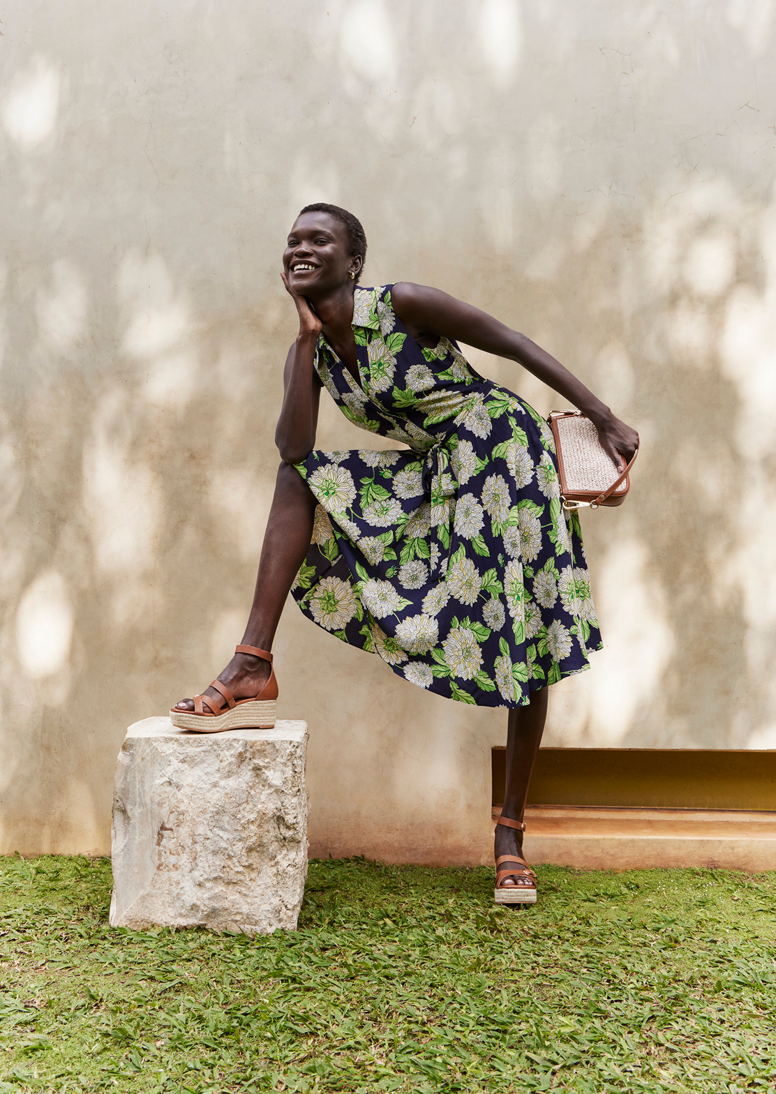An image of a model wearing a Hobbs’ fit and flare dress.