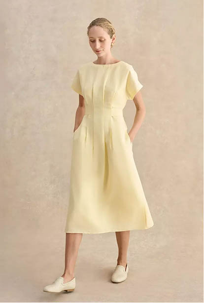 A woman wearing a Hobbs dress.