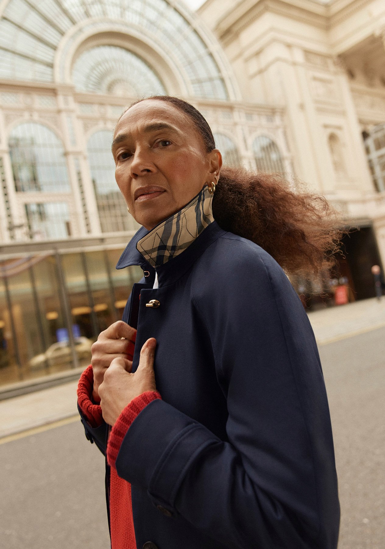 Women wearing different trench coats.