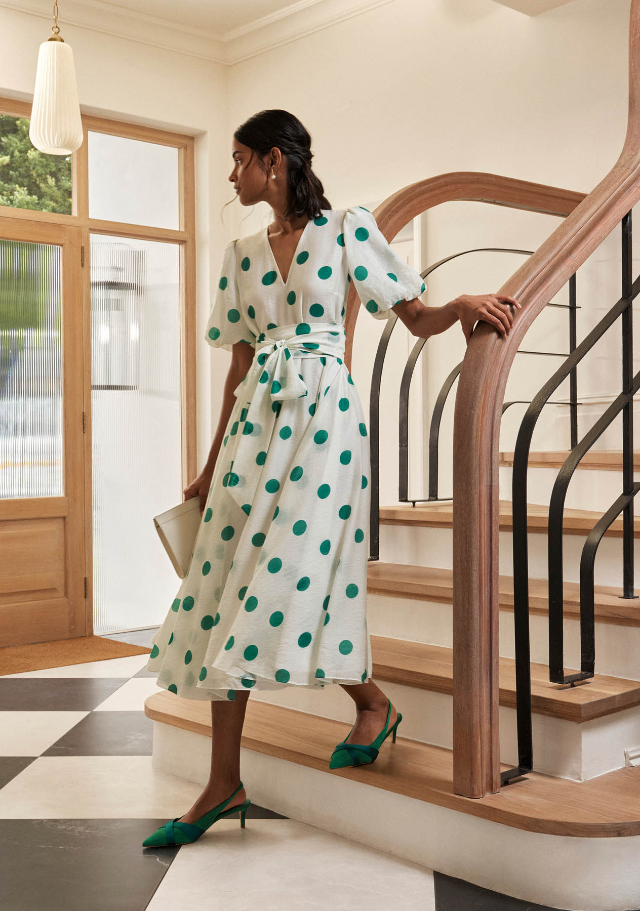A woman wearing a Hobbs polka dot dress