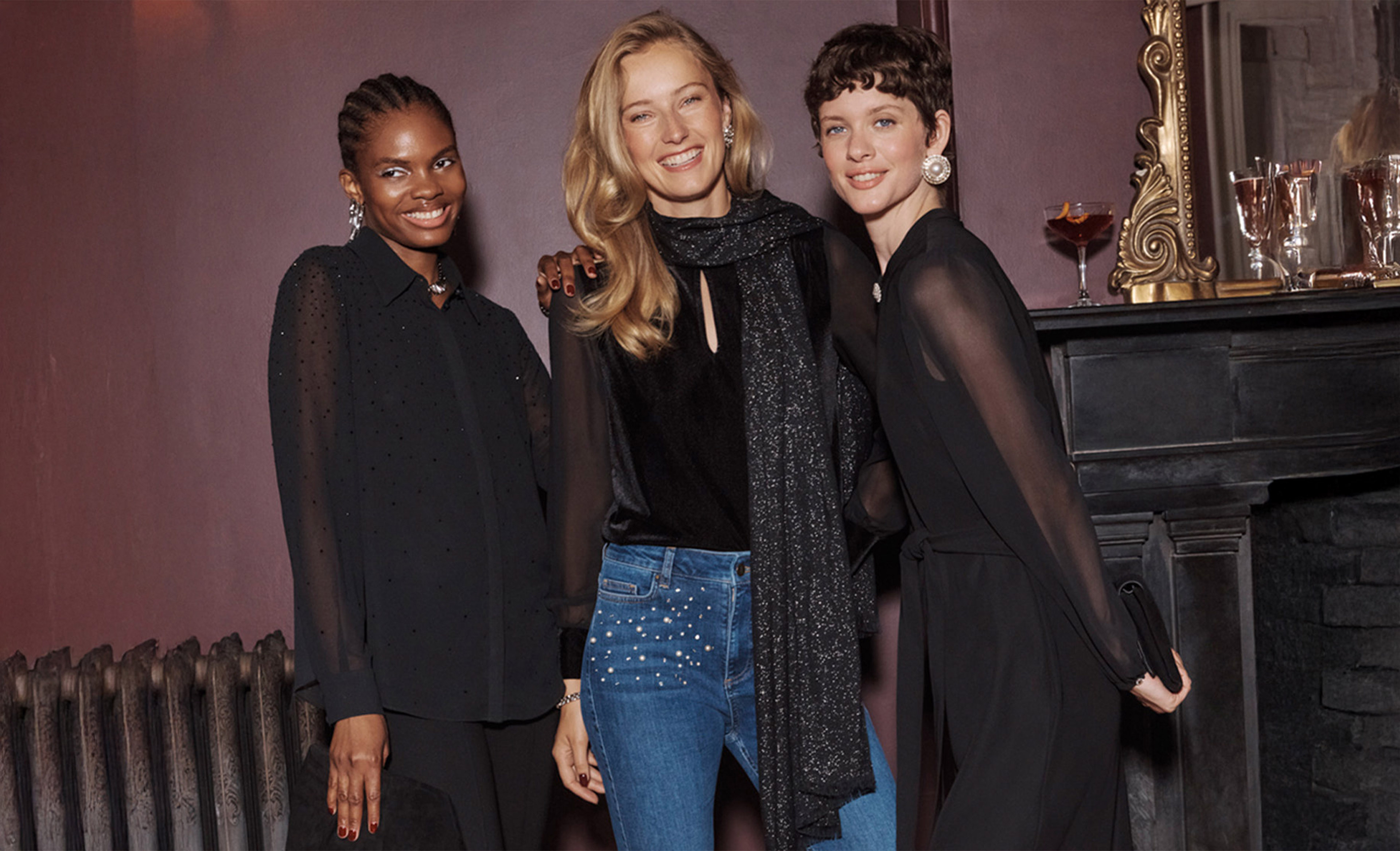 A woman wearing an embroidered Hobbs occasion dress