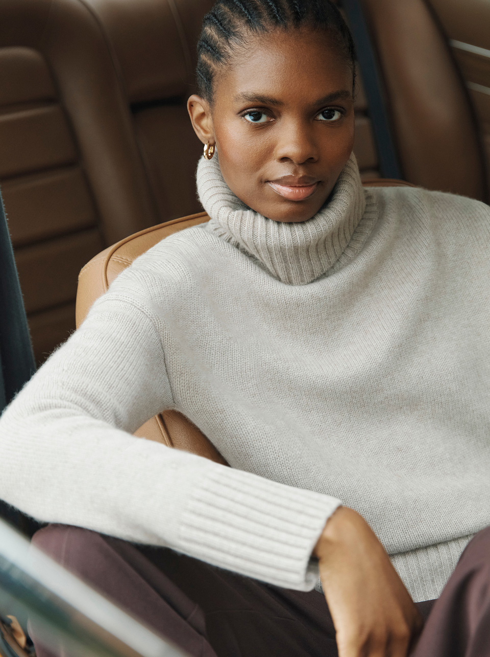 A woman wearing a Hobbs roll neck jumper.