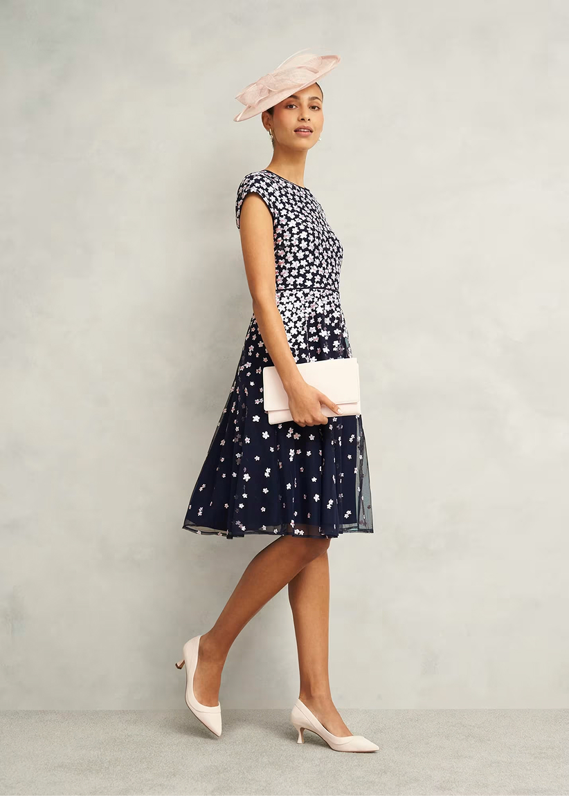 A collage of four images of models wearing floral occasion dresses from Hobbs.
