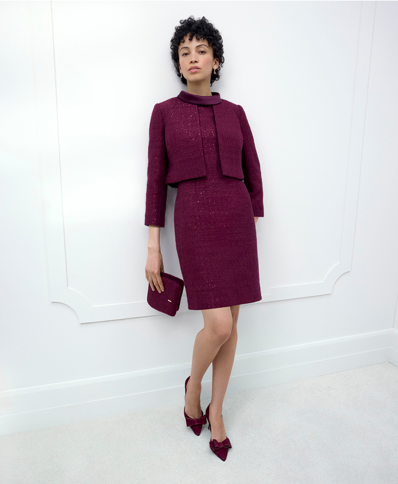 A woman wearing a Hobbs occasion dress and co-ordinating jacket.