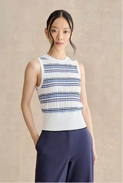 A woman wearing a Hobbs dress.