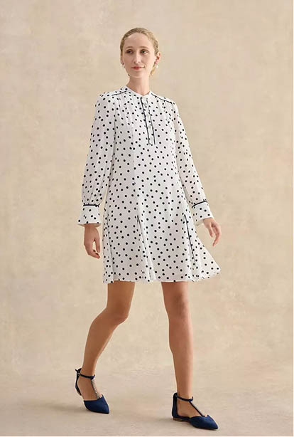 A woman wearing a Hobbs dress.