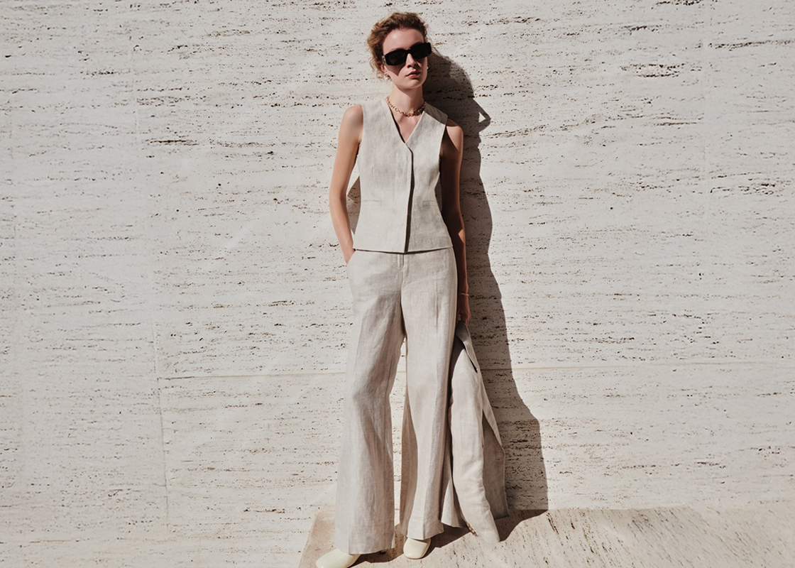 An image of a model wearing a beige Hobbs’ linen suit.