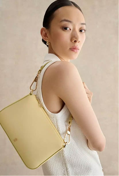 A woman wearing a Hobbs dress.