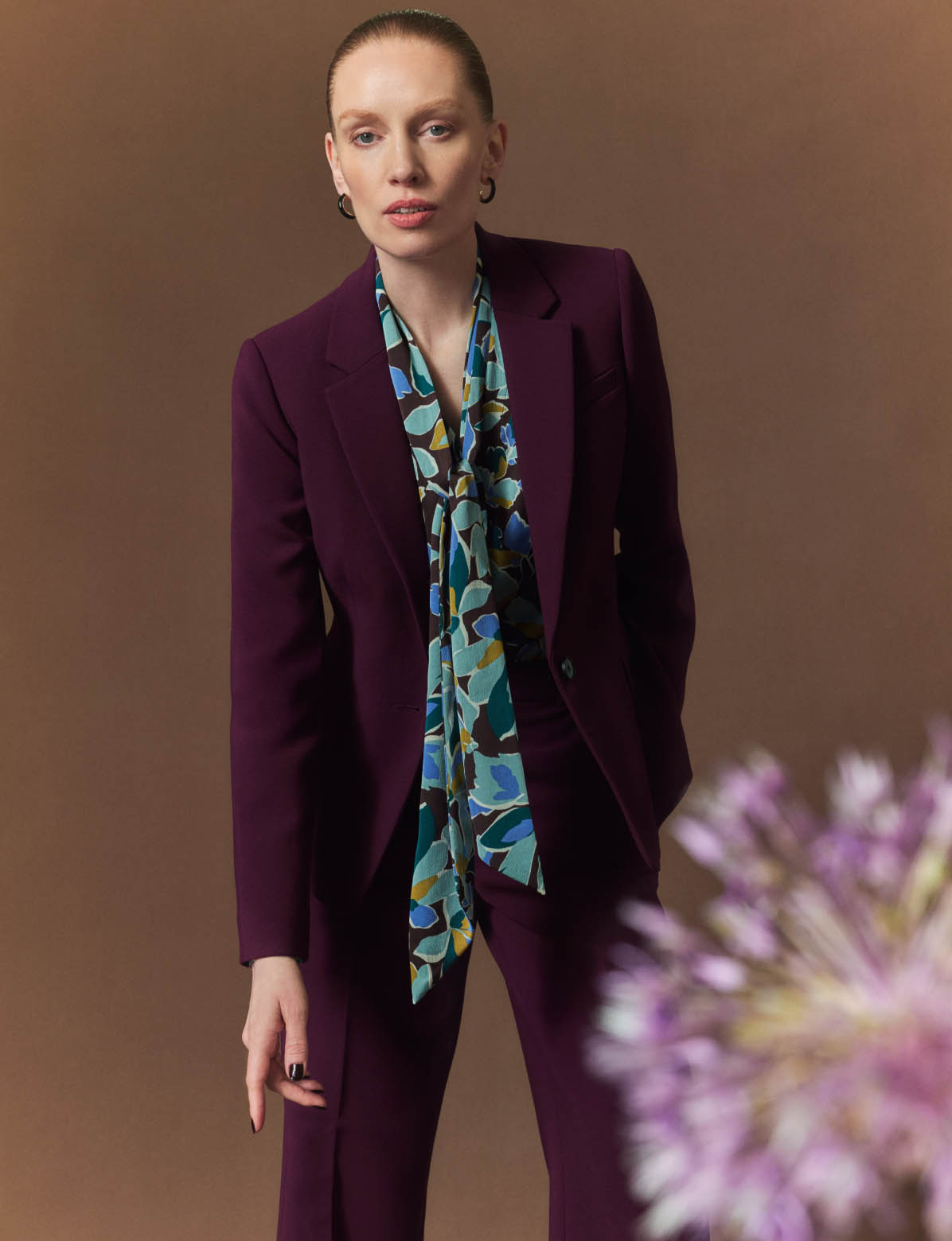 HOBBS MODEL WEARING MATCHING PLUM SUIT