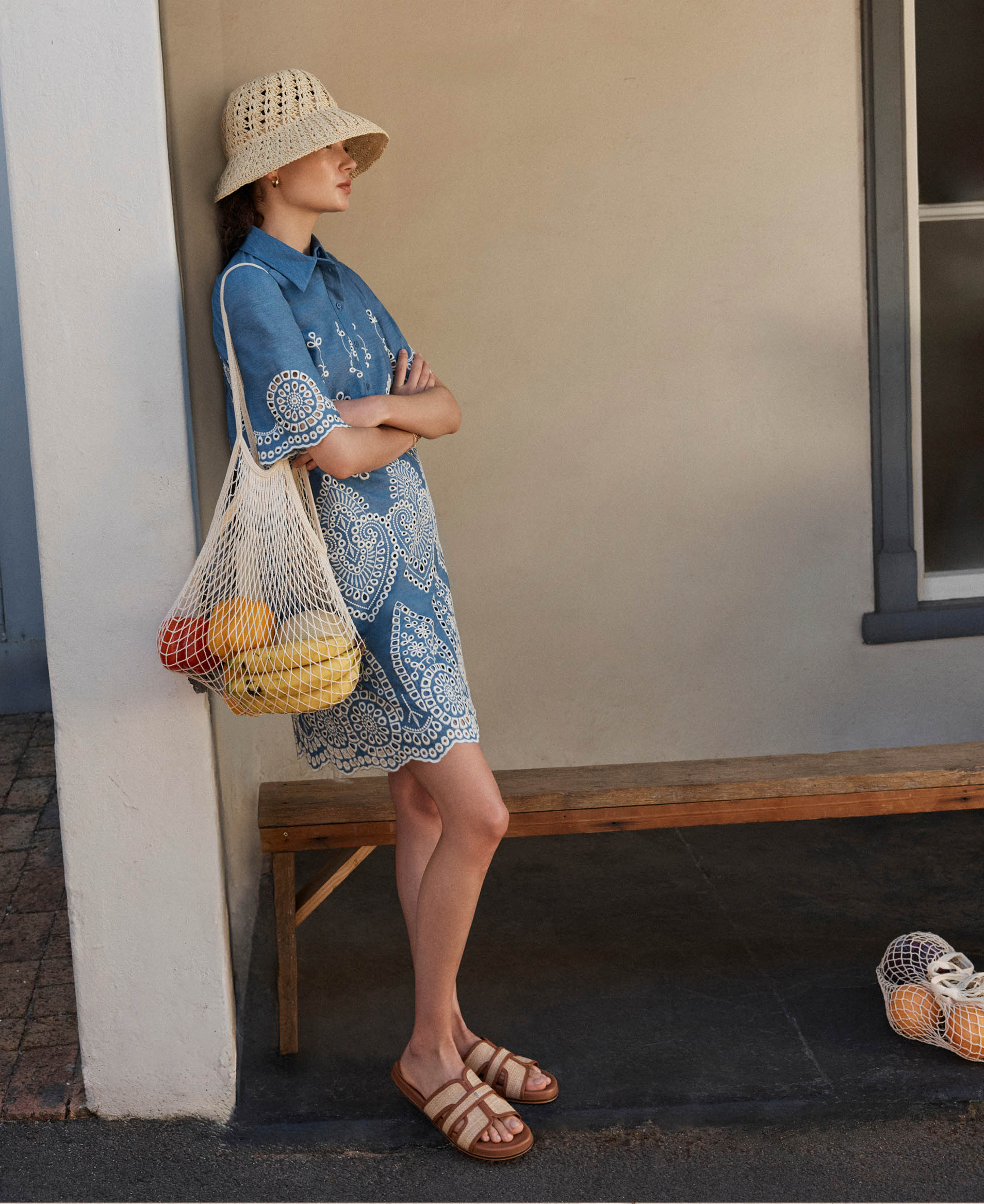 A woman wearing a short, Hobbs cotton dress.