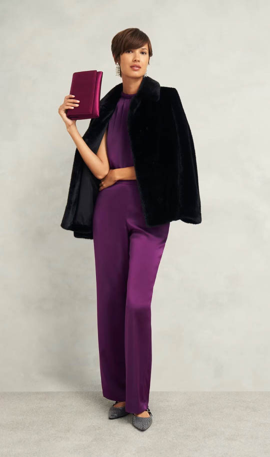 A gallery of images showing models wearing long coats over dresses, skirts and knitwear.