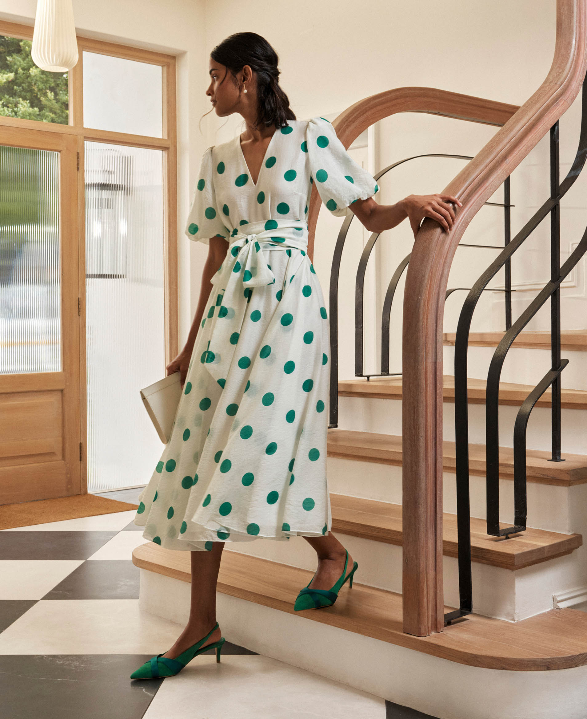 A woman wearing Hobbs occasion dresses.