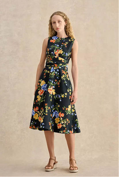 A woman wearing a Hobbs dress.