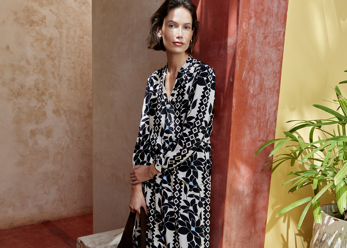 A woman wearing a Hobbs summer outfit.