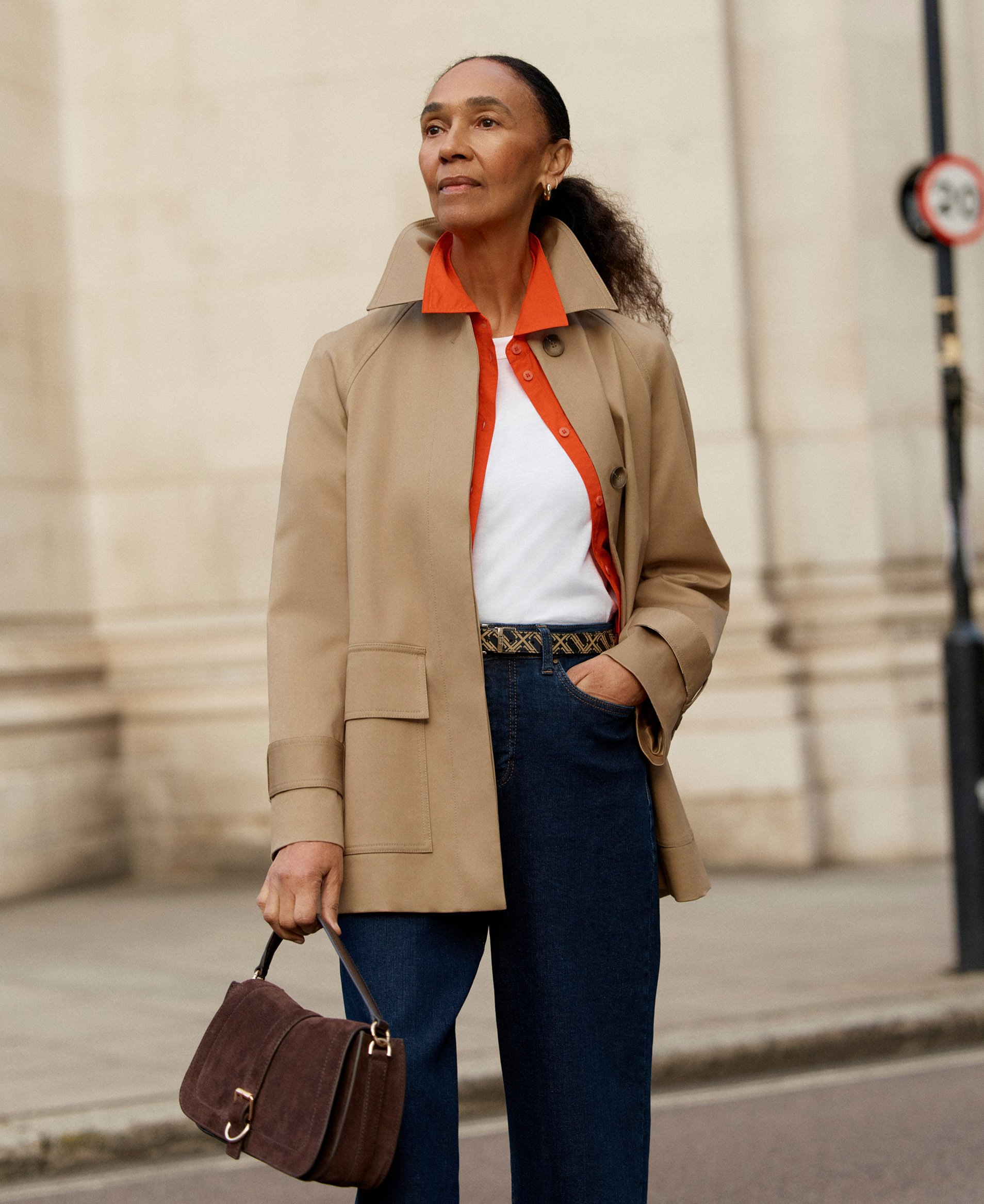 A woman wearing a tan utility jacket.