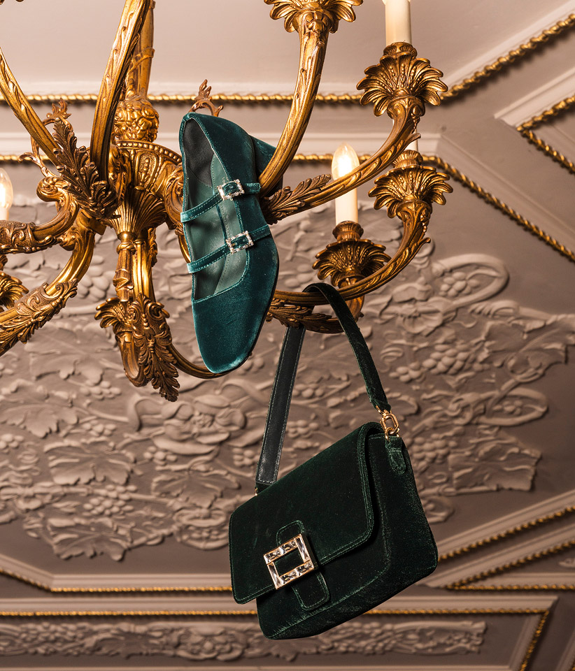 Women wearing chic Christmas party looks in jewel-tone colours.