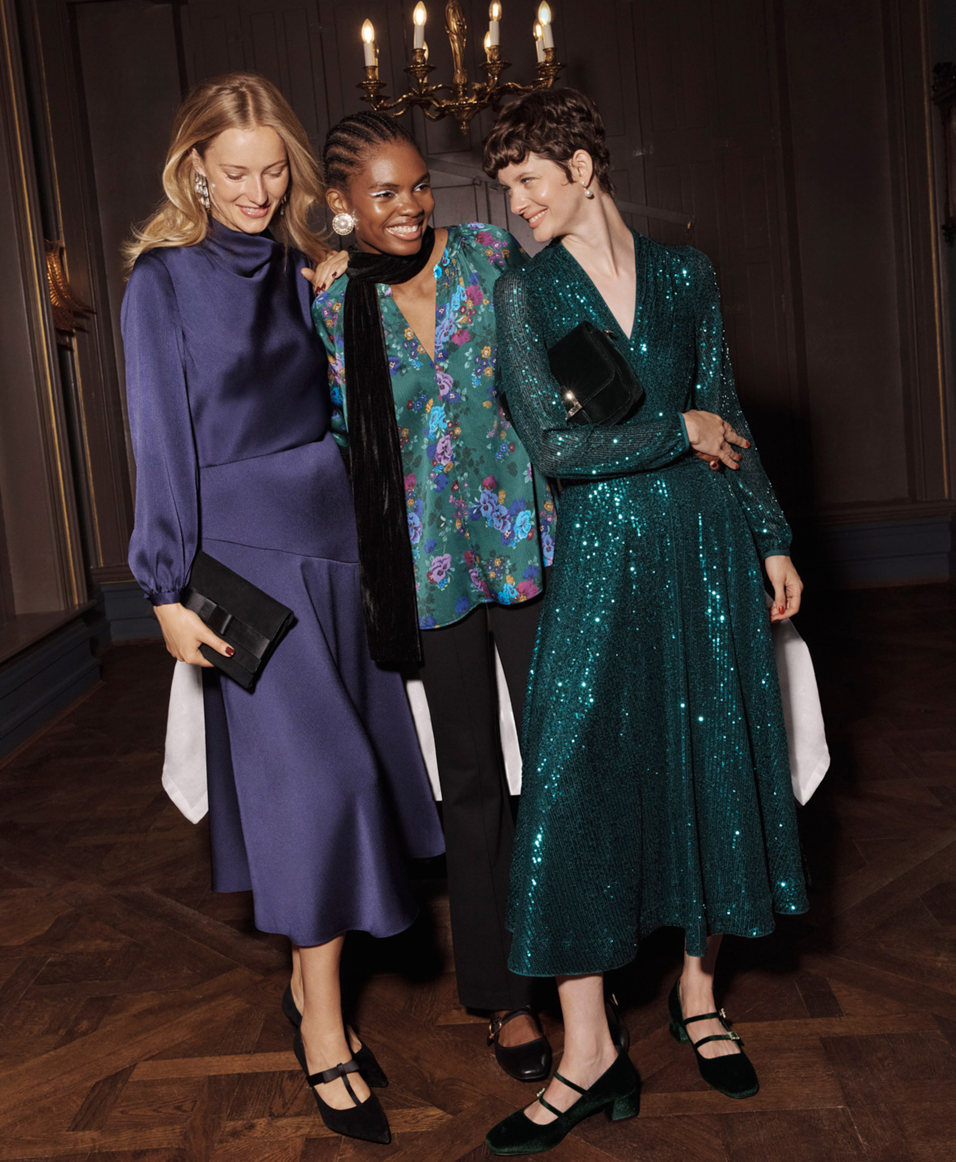 Three women wearing Hobbs new partywear collection.