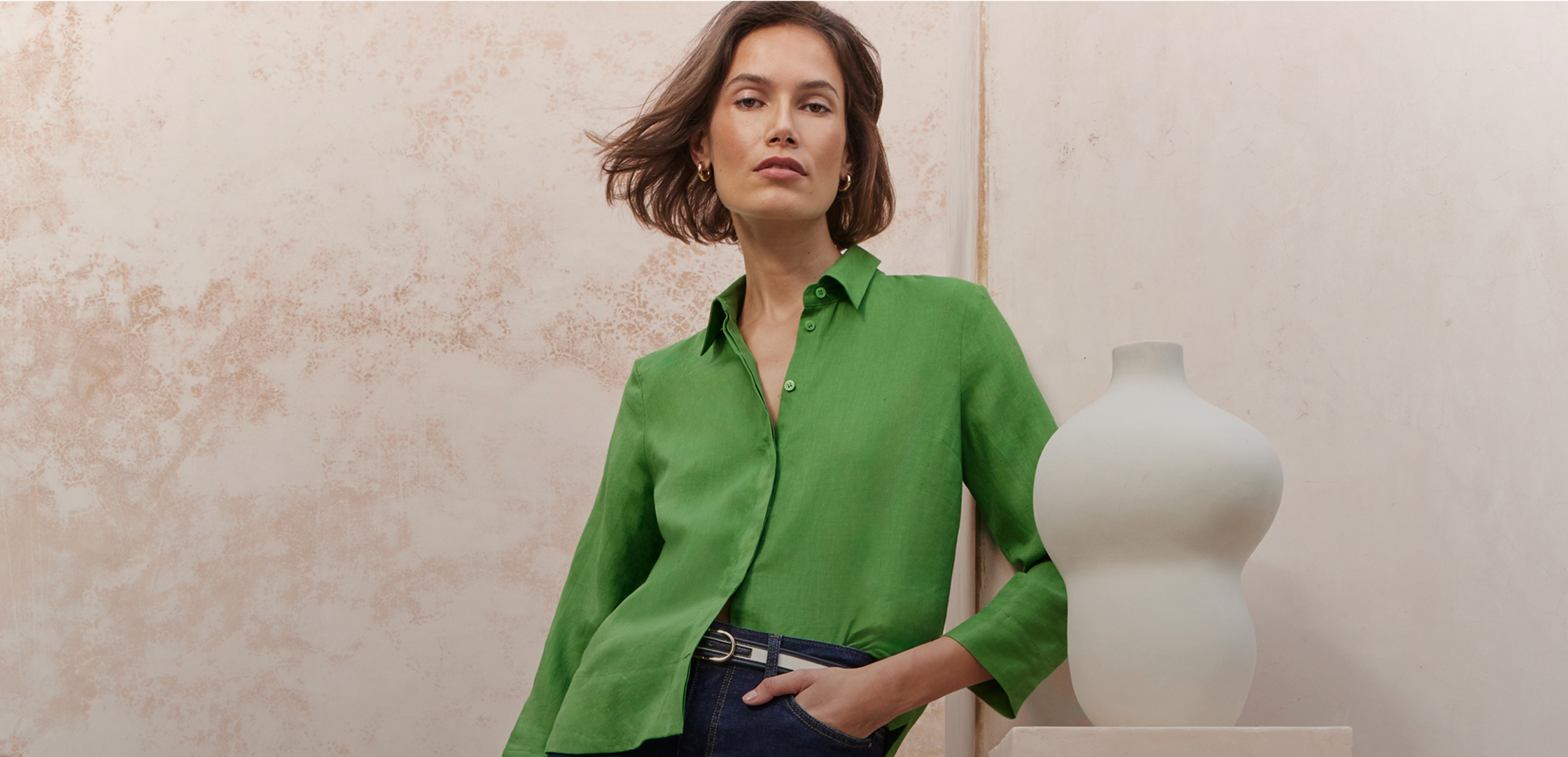 A woman wearing a Hobbs summer outfit.