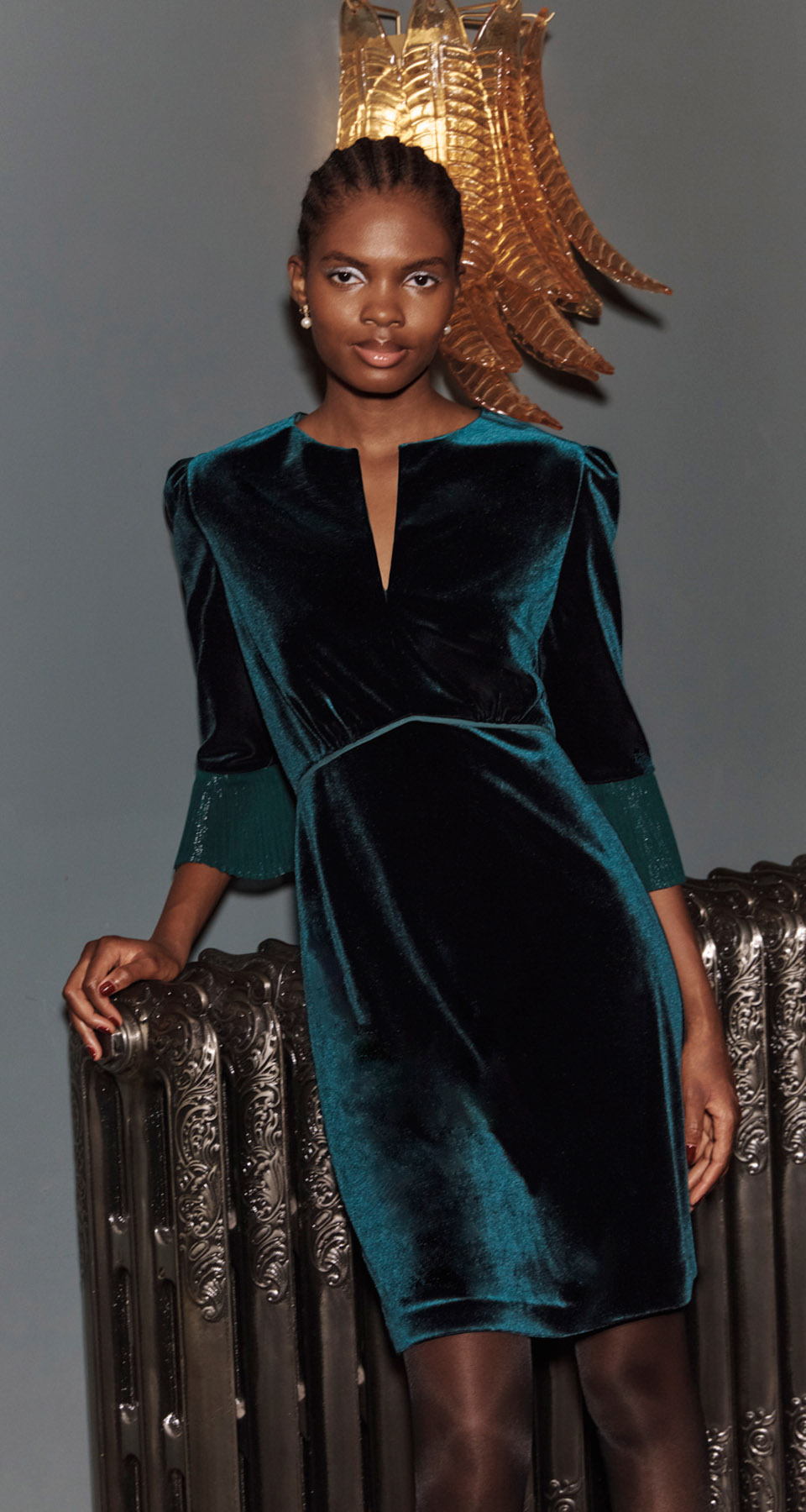 A woman wearing a Hobbs Velvet Dress.