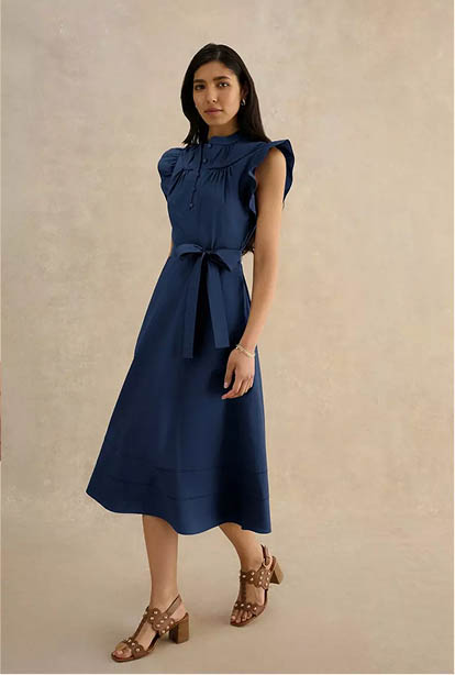 A woman wearing a Hobbs dress.