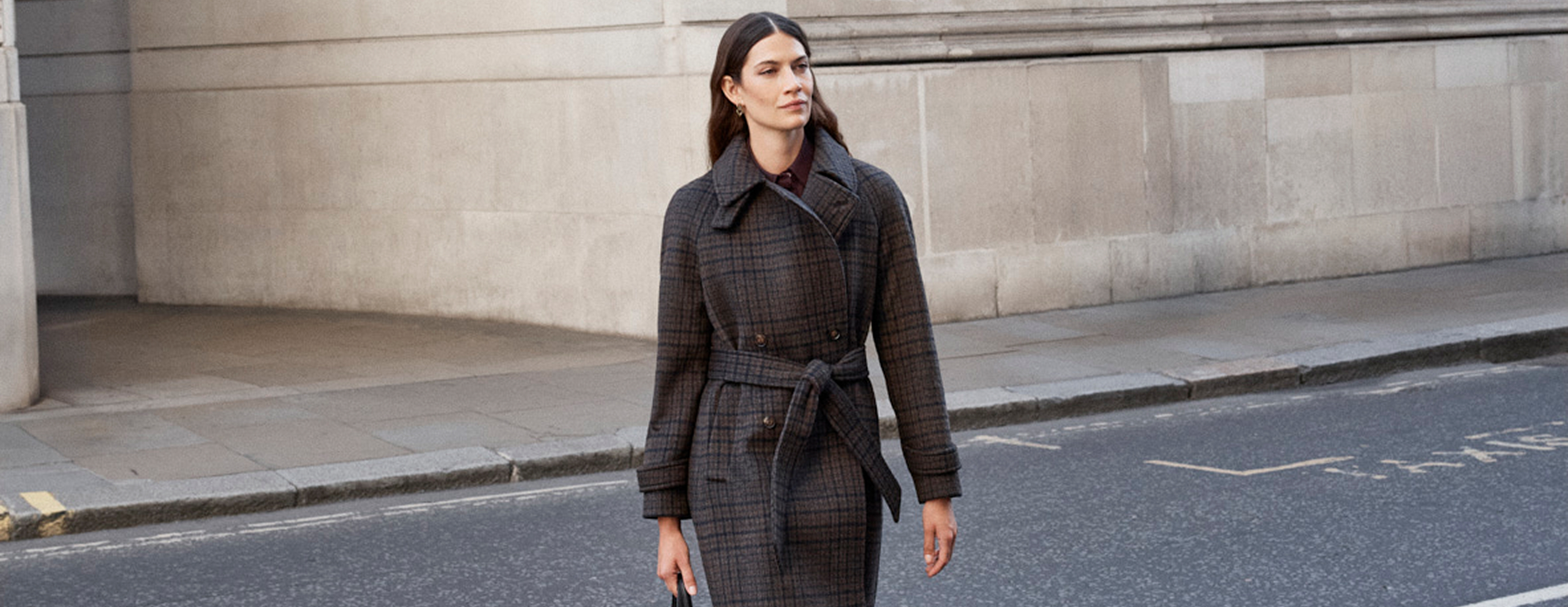 Model photographed in a coat.