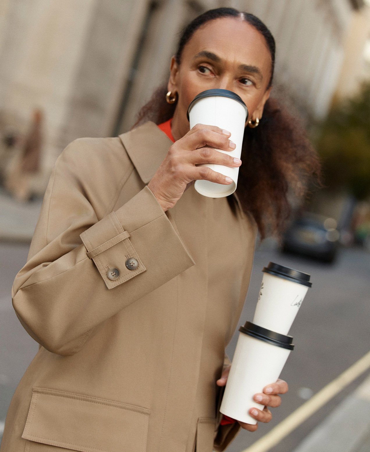 A woman wearing a tan utility jacket.