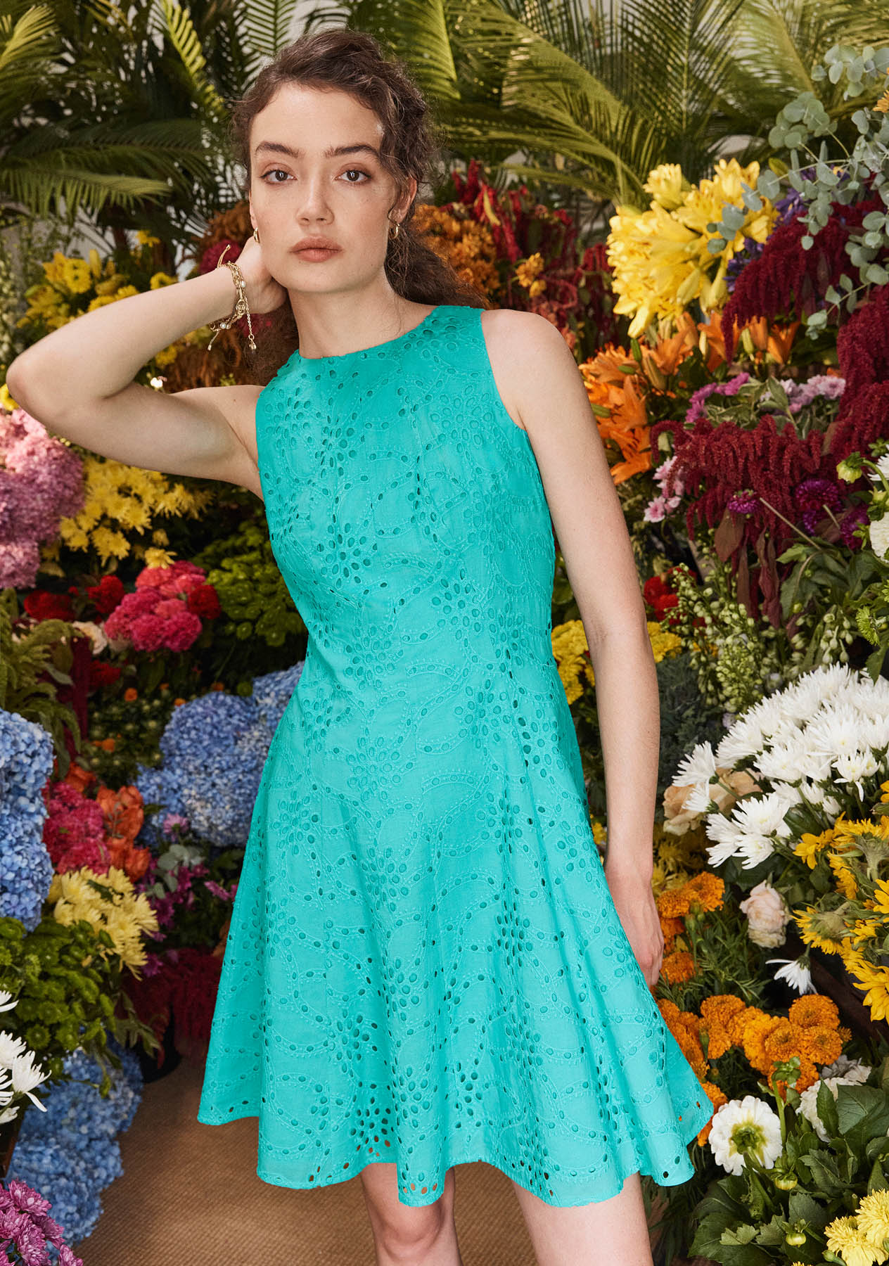 Model photographed in a blue dress.