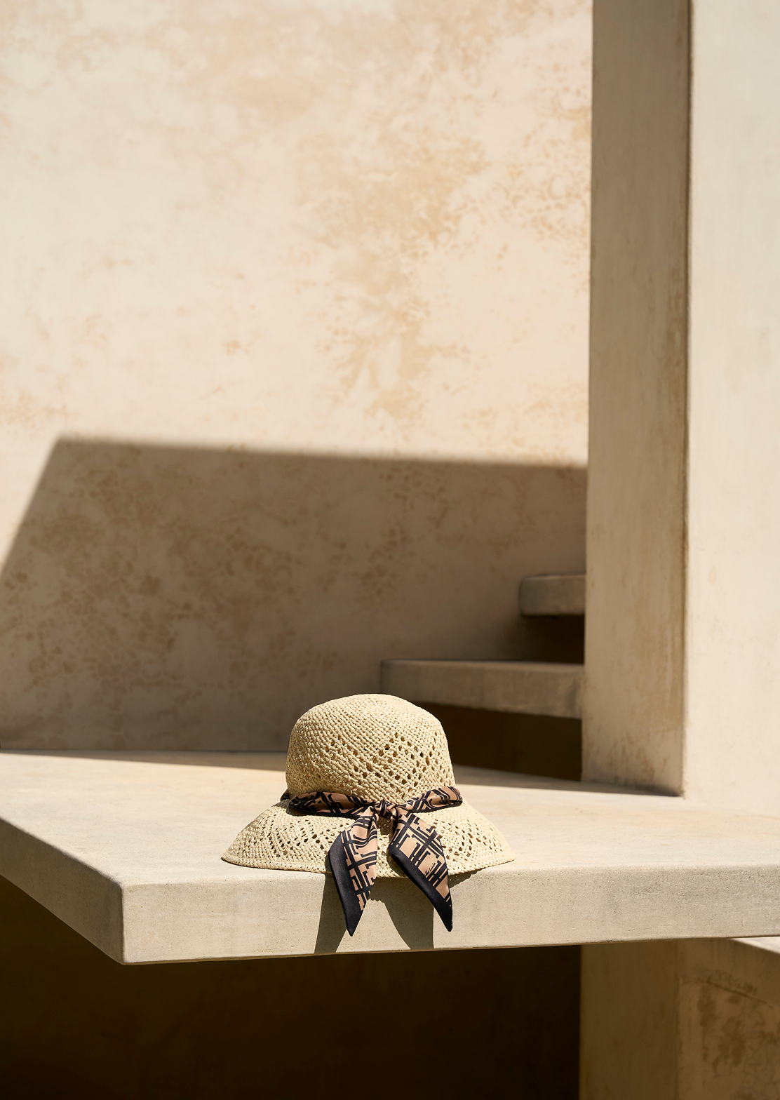 A collage of two images of Hobbs’ sandals and sun hats.