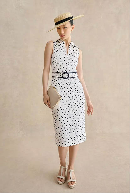 A woman wearing a Hobbs dress.