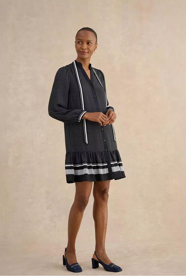 A woman wearing Hobbs dress.