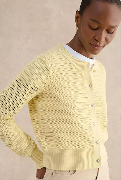 A woman wearing a Hobbs dress.