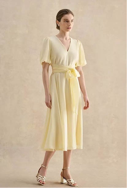 A woman wearing a Hobbs dress.