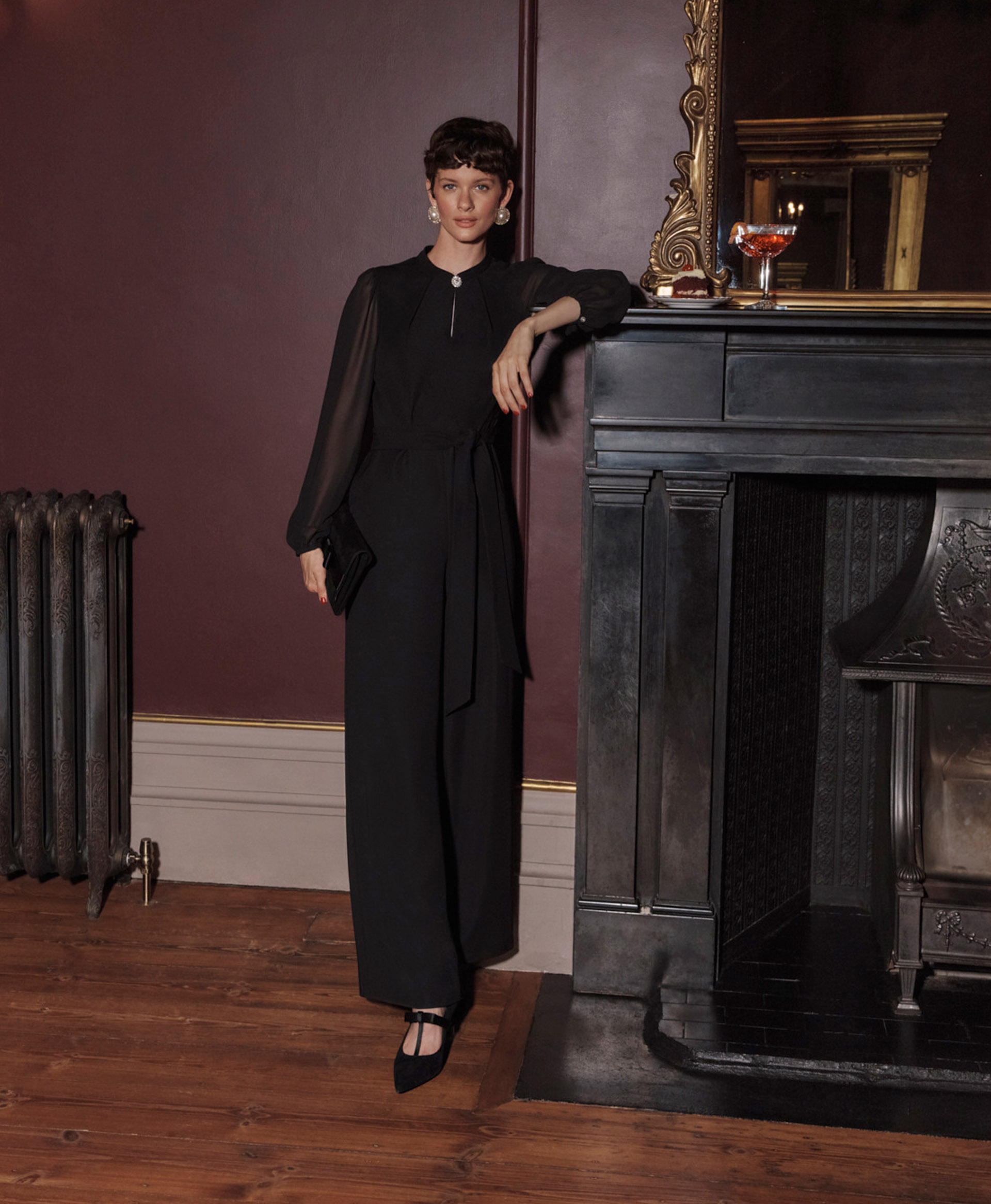 Women wearing formal Christmas party outfits.