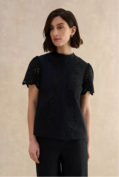 A woman wearing a Hobbs dress.