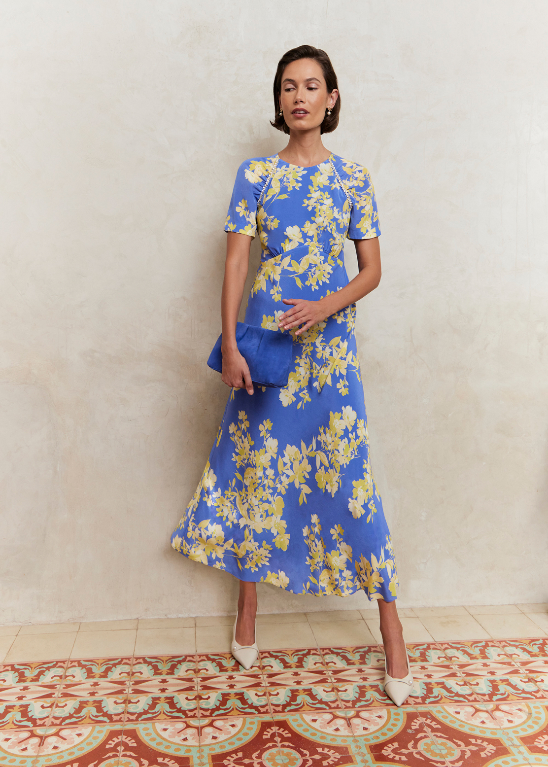 A woman wearing a Hobbs occasion dress.