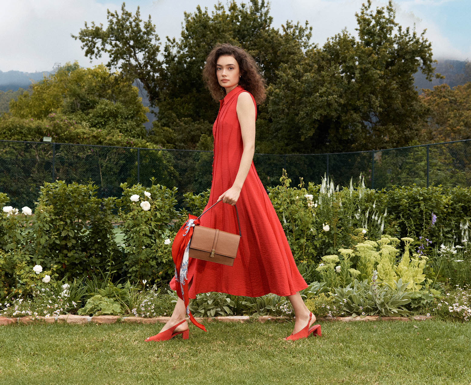 A woman wearing a Hobbs occasion dress.