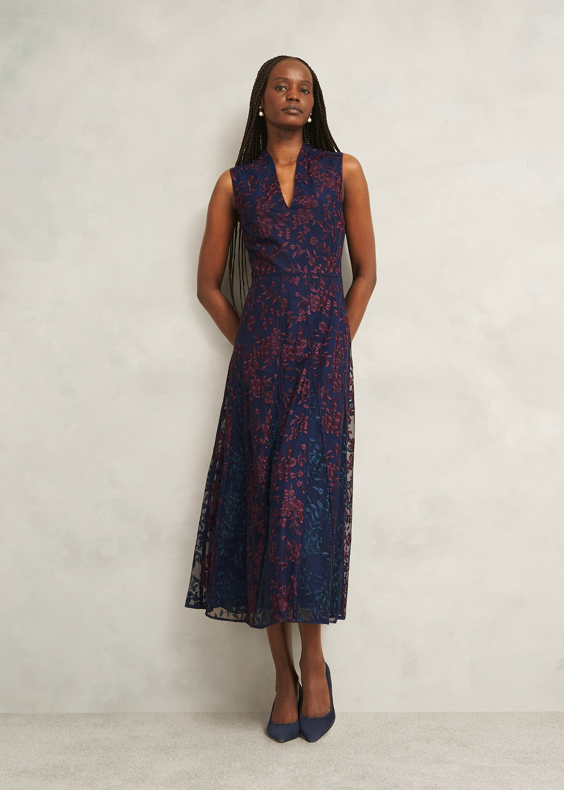 An image of a model wearing a floral lace occasion dress.