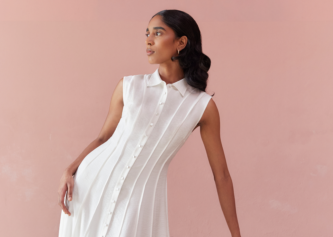 Model photographed in a white dress.