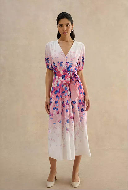 A woman wearing a Hobbs dress.